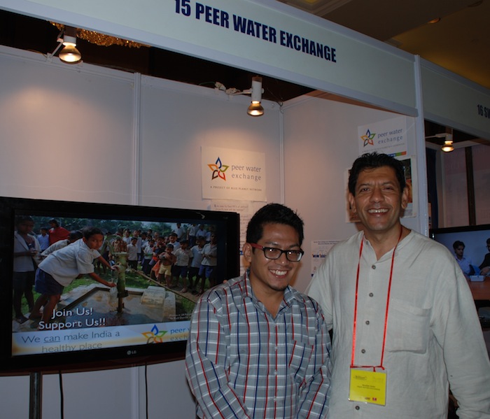 Rajesh Shah and volunteer Bharat at the PWX booth